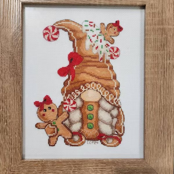 Christmas gnome with gingerbread house cross stitch finished piece by Cathy from South Carolina — festive handmade embroidery with warm holiday colors and cozy winter details