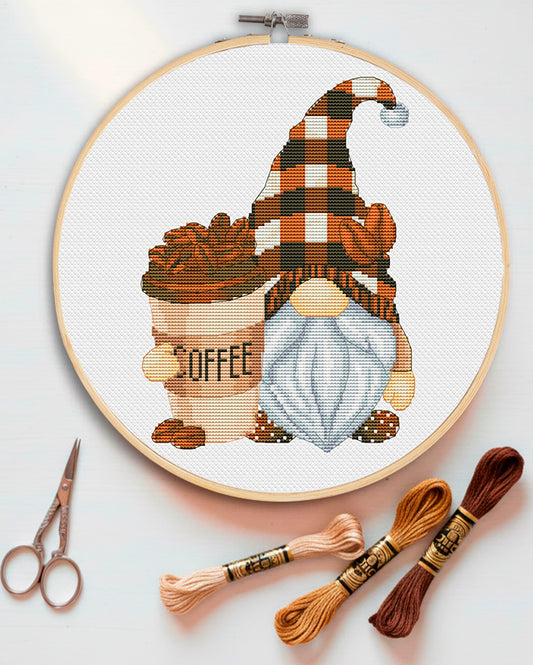 Cross stitch pattern of a Coffee Lover Gnome with a cup of cappuccino.