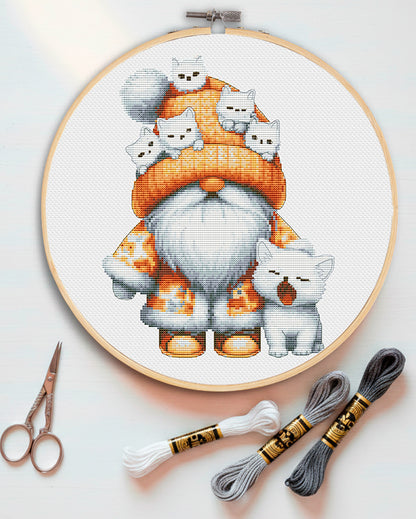 Cross stitch pattern of a Gnome with a cute cat friend.