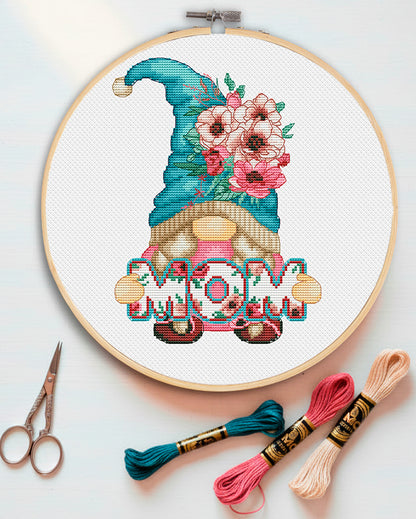 Cross stitch pattern of a Mom Gnome with flowers. Mother-themed gnome embroidery design. Digital PDF pattern for Mother's Day gift.