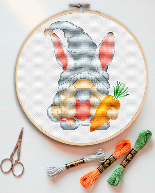 Cross stitch pattern of a Bunny Girl Gnome with long ears.