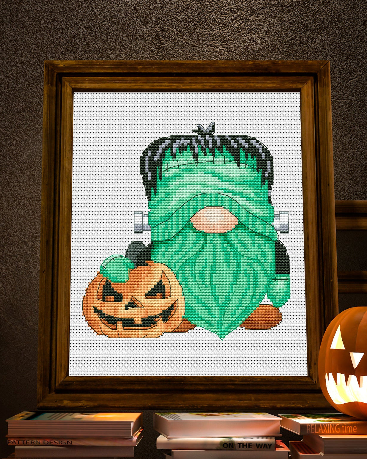Cross stitch pattern of a Halloween Gnome with spooky elements.