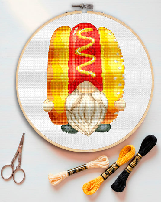 Cross stitch pattern of a gnome holding a hot dog.