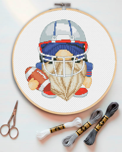 Cross stitch pattern of a Football Gnome with a ball and helmet.