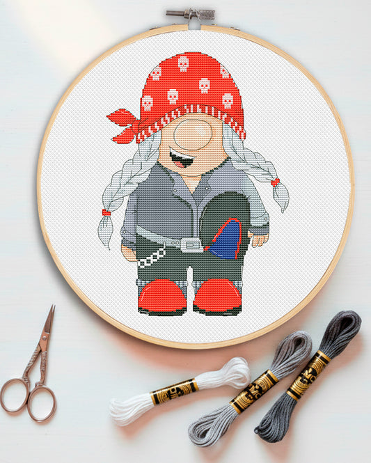 Cross stitch pattern of a Biker Girl Gnome with a motorcycle theme.