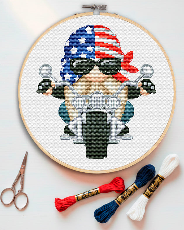 Cross stitch pattern of a motorcyclist biker gnome.