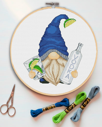 Cross stitch pattern of a gnome holding a vodka bottle.