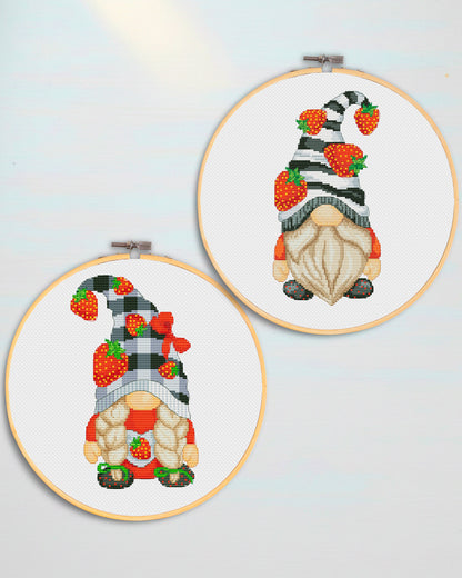 Two cross-stitched gnomes in embroidery hoops on a light blue background